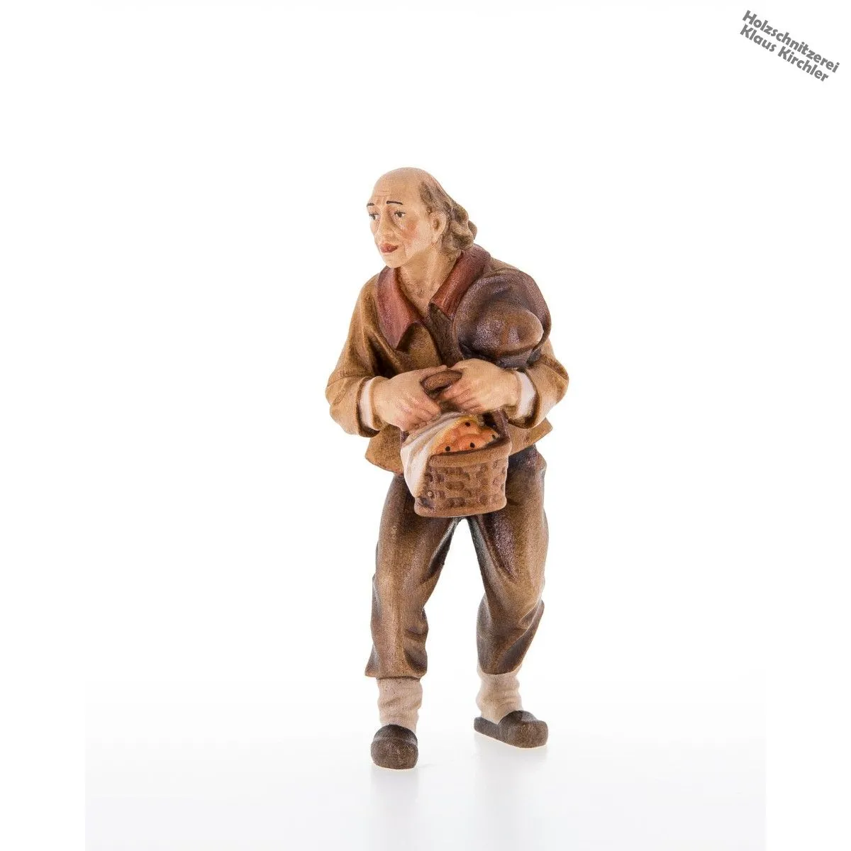 Pastore con cappello e cesto di frutta