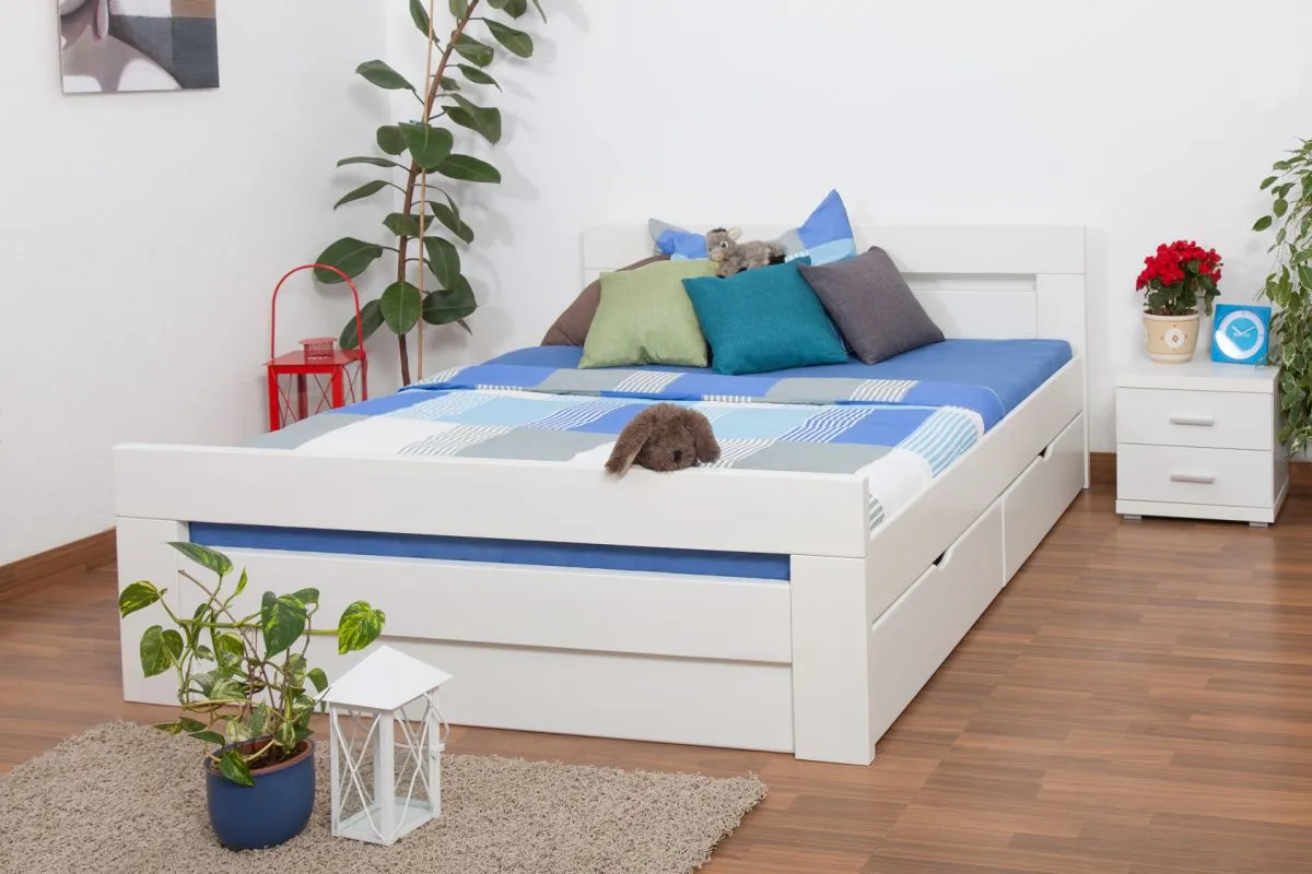 Doppelbett / Stauraumbett "Easy Premium Line" K6 inkl. 2 Schubladen und 1 Abdeckblende 160 x 200 cm Buche Vollholz massiv weiß lackiert
